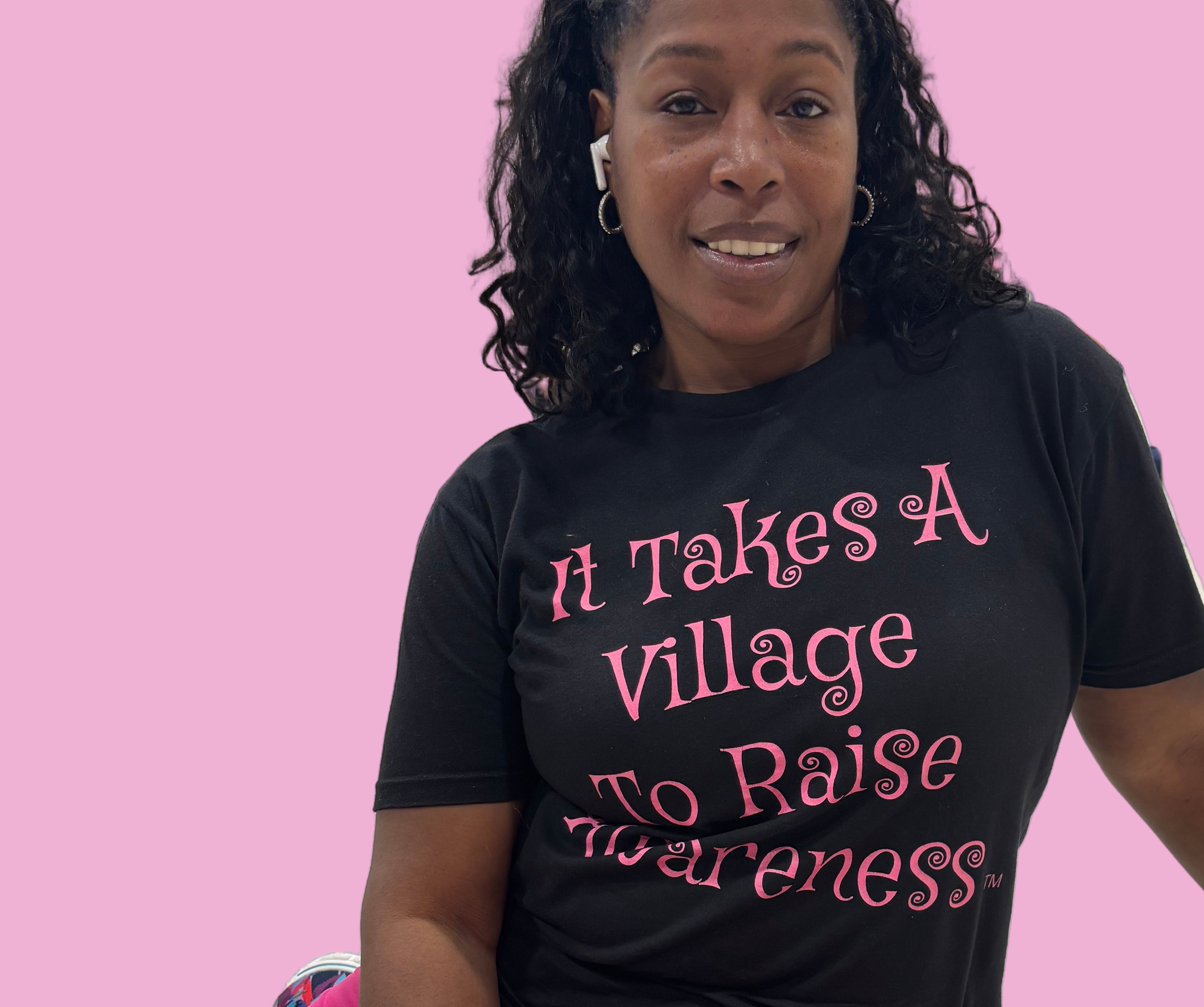 Founder of It Takes a Village To Raise Awareness wearing black brand tee